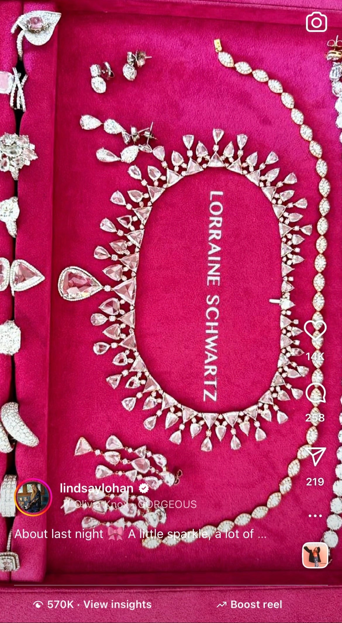 Jewelry set on a pink Lorraine Schwartz box with social media interface elements.